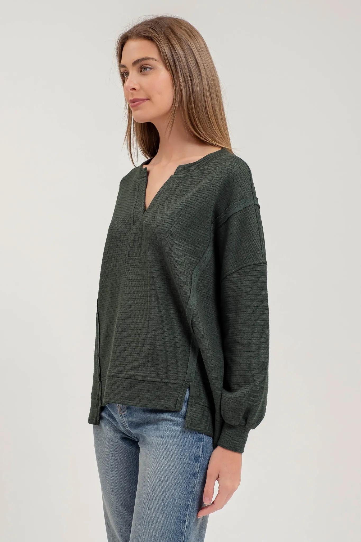 SPLIT NECK EXPOSED SEAM LONG SLEEVE KNIT TOP